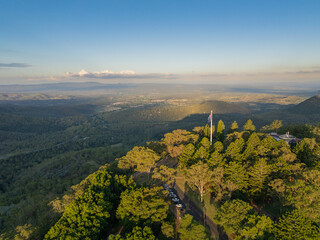 Scenic elevated views of the Australia flag on display at the Picnic Point public park area in Toowoomba with Table Top Mountain and the Bushland Reserve in the background, Queensland, Australia