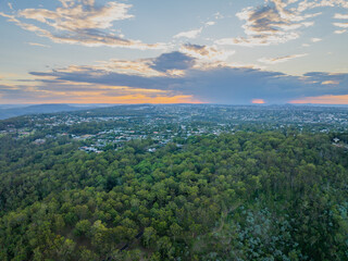 Scenic elevated views of the Australia flag on display at the Picnic Point public park area in Toowoomba with Table Top Mountain and the Bushland Reserve in the background, Queensland, Australia