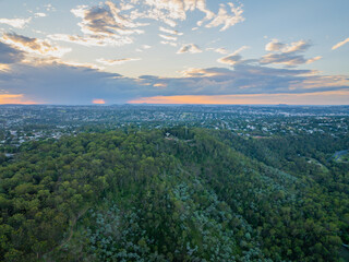 Scenic elevated views of the Australia flag on display at the Picnic Point public park area in Toowoomba with Table Top Mountain and the Bushland Reserve in the background, Queensland, Australia