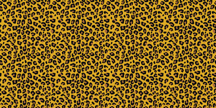 Vibrant yellow leopard print pattern with black spots