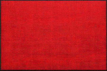Vivid red fabric with fine, woven texture and subtle irregularities