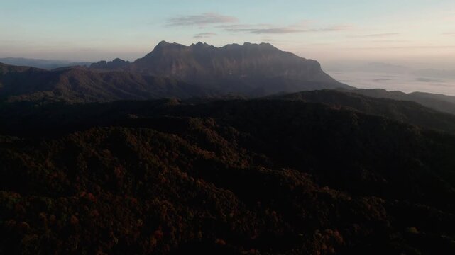 Landscape of Morning Mist with Mountain Layer. mountain ridge and clouds in rural jungle bush forest