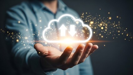 A person holds a glowing cloud icon surrounded by sparks and light