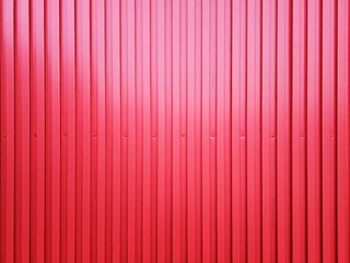 Red Corrugated Metal Sheet Texture Background with Spotlight from Top.