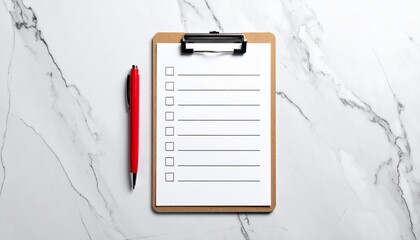Top-down shot of a clipboard, lined paper, pen, and blank check boxes on marble