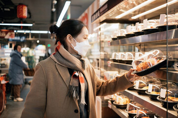 Woman Wearing Mask Shopping for Food in Supermarket