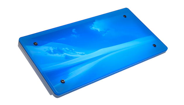Angled shot of a rectangular device with a blue, sky-themed surface. Screws secure the surface. A black background - Powered by Adobe