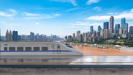 High - speed train passing modern city skyline