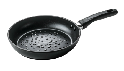 A non-stick, dark-colored frying pan with a long handle, displayed on a black background. The pan has water droplets