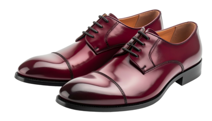 A pair of polished, burgundy leather oxford shoes with black laces. The shoes are set against a transparent background