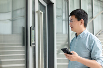 Man uses phone to unlock door device