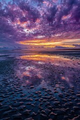 Sunset Over Coastal Beach With Reflections