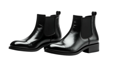 A sleek studio shot of two black leather ankle boots, side-by-side, showcasing a glossy finish on a dark background