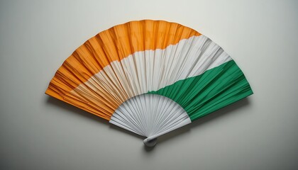 Traditional hand fan in Indian tricolor colors arranged in elegant studio lighting best for cultural design, patriotic themes, and national concepts