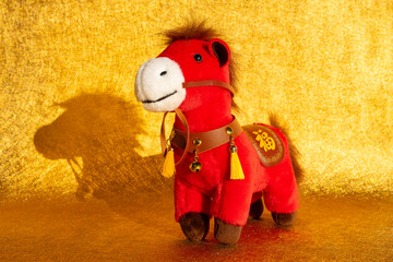 Chinese New Year of Horse mascot on golden background the Chinese word means fortune
