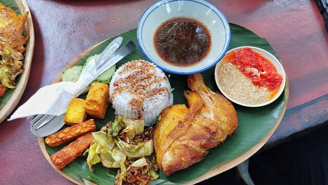chicken and vegetable salad, ayam penyet in Indonesia restaurant 