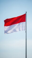 Indonesian Flag Waving Against Clear Sky