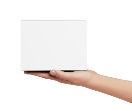Human hand presenting a blank white cube-shaped box, providing ample copy space for branding, product display, e-commerce, or gift giving concepts on a clean background