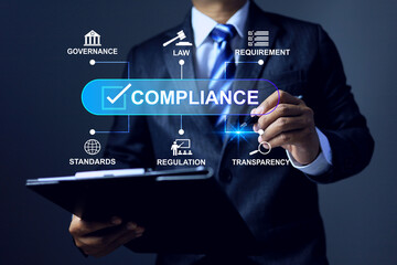 Compliance concept with businessman holding clipboard working to applied standard and regulation to meet business requirement
