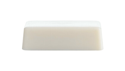 A close-up shot on a stark black background, a bar of soap, rectangle shape. Rounded edges and simple design