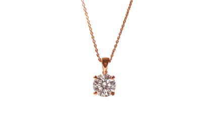 A close-up shot of a delicate, rose-gold necklace with a single, brilliant-cut diamond pendant suspended against a stark black background