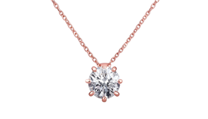 A close-up shot of a delicate rose gold necklace featuring a single, brilliant-cut diamond pendant against a solid black backdrop