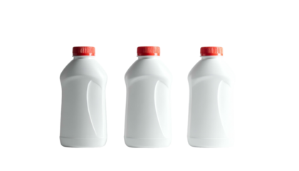 Three identical white bottles, each with a red cap, are aligned against a stark black background, highlighting their clean shapes