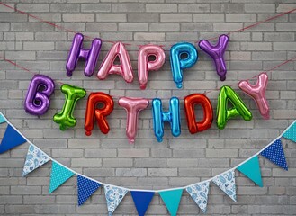 Happy Birthday balloon letters on brick wall with blue party bunting flags, colorful foil typography decoration for celebration background