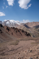 High altitude mountain landscape in August. Majestic peaks and glaciers of Trans-Ili Alatau at 3000 meters above sea level, Almaty, Kazakhstan.