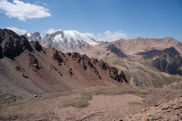 High altitude mountain landscape in August. Majestic peaks and glaciers of Trans-Ili Alatau at 3000 meters above sea level, Almaty, Kazakhstan.