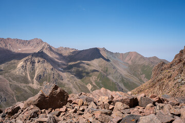 High altitude mountain landscape in August. Majestic peaks and glaciers of Trans-Ili Alatau at 3000 meters above sea level, Almaty, Kazakhstan.