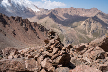 High altitude mountain landscape in August. Majestic peaks and glaciers of Trans-Ili Alatau at 3000 meters above sea level, Almaty, Kazakhstan.
