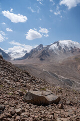 High altitude mountain landscape in August. Majestic peaks and glaciers of Trans-Ili Alatau at 3000 meters above sea level, Almaty, Kazakhstan.