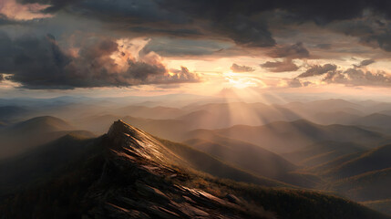 Sun Rays Breaking Through Clouds Over Mountain Ridge