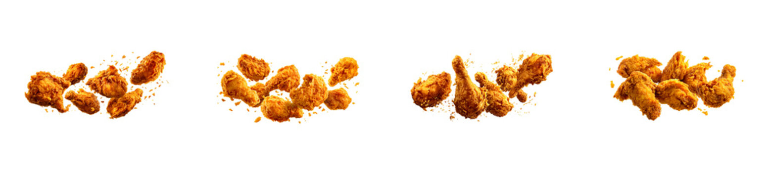 Crispy golden fried chicken pieces with seasoned breading crumbs flying in dynamic motion, perfect for fast food restaurant menus or delicious cooking recipe advertisements.