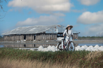 Traditional salt farm in Thailand under bright sunlight