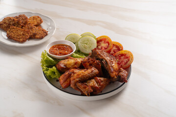 Ayam Goreng Lengkuas Kremes or Galangal Fried Chicken, One of Indonesia's culinary icons. Perfect for recipes, articles or any cooking content.