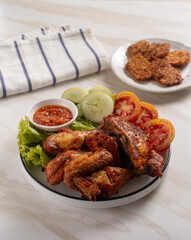 Ayam Goreng Lengkuas Kremes or Galangal Fried Chicken, One of Indonesia's culinary icons. Perfect for recipes, articles or any cooking content.