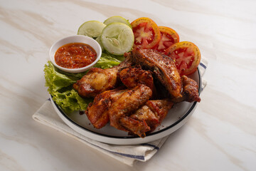 Ayam Goreng Lengkuas Kremes or Galangal Fried Chicken, One of Indonesia's culinary icons. Perfect for recipes, articles or any cooking content.