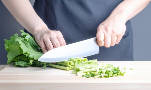 包丁で野菜を切る