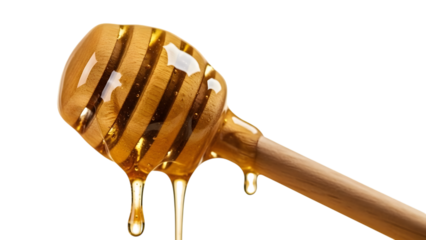 Honey dripping from a wooden honey dipper