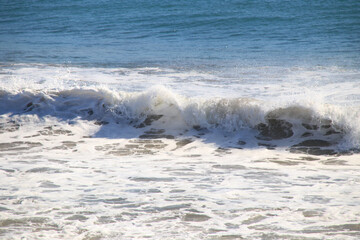 Fototapeta premium Wave Crests and Breaks Near the Shore on a Sunny Day at Myrtle Beach