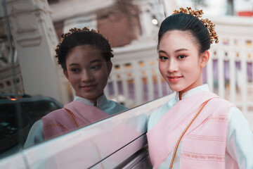 Cultural portrait of young woman urban setting reflection