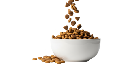 Chocolate chips falling into a white bowl.