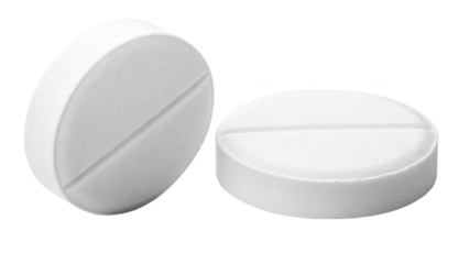 Two white oval and round tablets or pills on black background