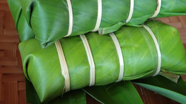 Khao Tom Mud before cooking,Traditional Thai dessert sticky rice, coconut milk and banana wrapped in banana leaves