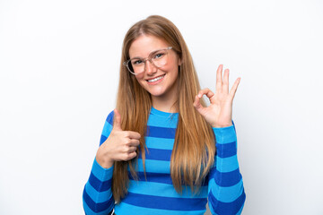 Young caucasian woman isolated on white background showing ok sign and thumb up gesture