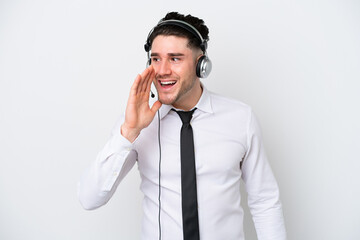 Telemarketer caucasian man isolated on white background shouting with mouth wide open to the side