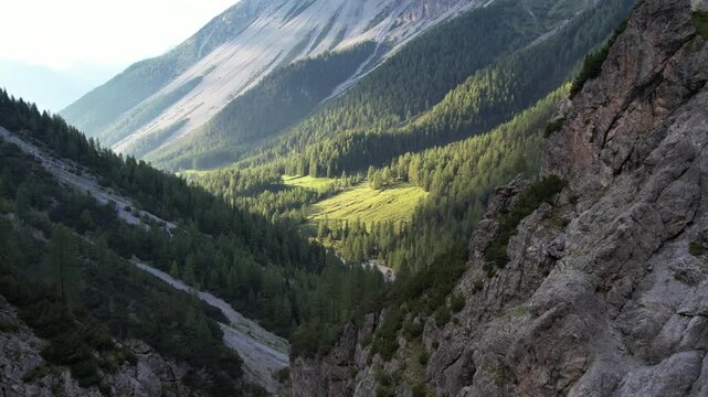 Cinematic Drone Shot of Couple Hiking Rocky Alpine Cliff in Swiss Alps &ndash; Adventure, Freedom and Epic Mountain Landscape