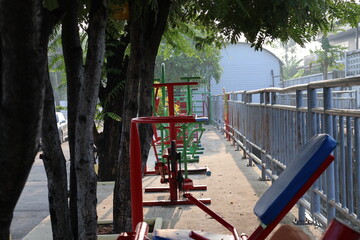 Outdoor Fitness Equipment in a Small Village Public Park in Thailand under Shade Trees